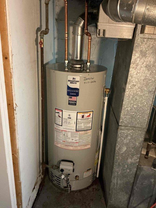Completed installation of a 40-gallon short Bradford White gas water heater in basement utility area. Performed necessary gas piping repairs to ensure safe and proper fuel supply to the new unit. Connected copper supply and discharge lines with shutoff valves, verified all connections for leaks, and ensured proper venting configuration. Unit was tested for proper operation and all safety protocols were confirmed prior to completion.