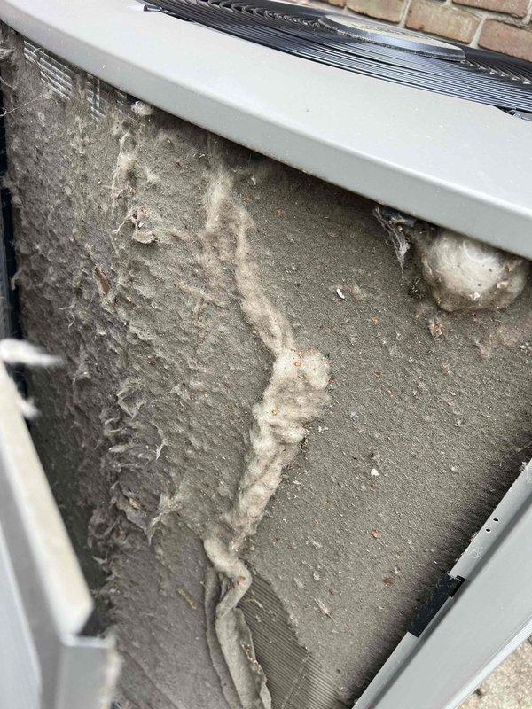 Completed comprehensive Gold AC Inspection and tune-up on 2-year-old outdoor condensing unit. Performed full system evaluation including refrigerant level check, electrical component testing, and airflow assessment. Discovered heavily soiled evaporator coil with significant dust, dirt, and debris accumulation restricting airflow and reducing system efficiency. Thoroughly cleaned coil assembly to restore proper heat exchange capacity and optimize performance. Inspected condenser unit exterior, verified proper operation of all mechanical components, and confirmed unit is functioning within manufacturer specifications. System now operating at peak efficiency with improved airflow following coil cleaning. Recommended continued annual maintenance to prevent future buildup and ensure optimal system longevity.