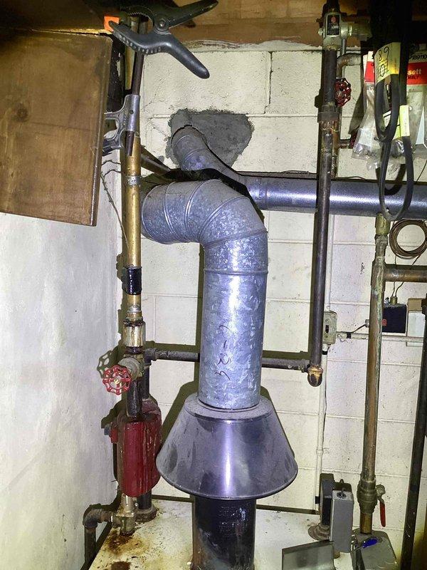 Conducted comprehensive boiler estimate for residential heating system replacement. Evaluated existing boiler installation, associated piping configuration including water supply lines with shutoff valves, and electrical service panel capacity to determine system requirements. Documented current equipment setup featuring specialized piping assembly with isolation valves and support brackets mounted to foundation wall. Assessed electrical infrastructure and conduit routing for compatibility with new boiler installation specifications. Provided detailed photographic documentation of mechanical room layout and existing utility connections to support accurate proposal development.
