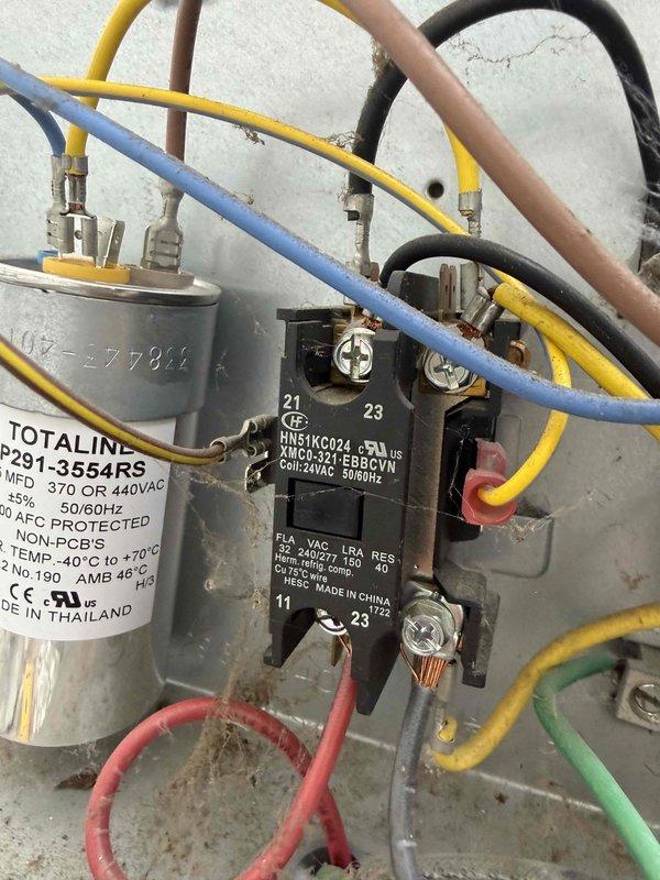Responded to no cooling complaint on 8-year-old AC system located in basement. Upon inspection, found failed contactor (model HN51KC024) preventing compressor operation. Replaced defective contactor, verified proper voltage to capacitor (Totaline P291-3554RS rated 370/440VAC), tested system operation, and confirmed unit now cooling properly.