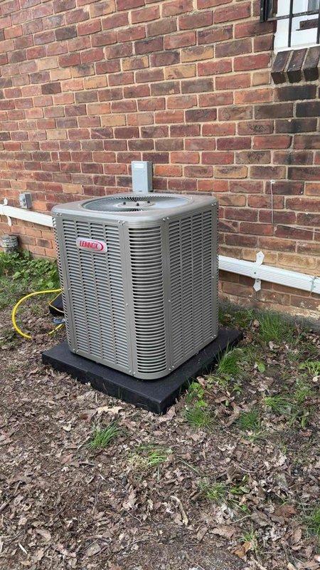 Completed full HVAC system installation including new Lennox outdoor condenser unit and indoor evaporator coil for rental property. Installed condenser on rubber pad against exterior brick wall with proper PVC condensate drainage and electrical connections. Indoor coil integrated with existing furnace system in basement with new refrigerant lines, ductwork connections, and gas line configuration. All components tested for proper operation, refrigerant charge verified, and system commissioned successfully. Permit obtained and installation completed per customer specifications.