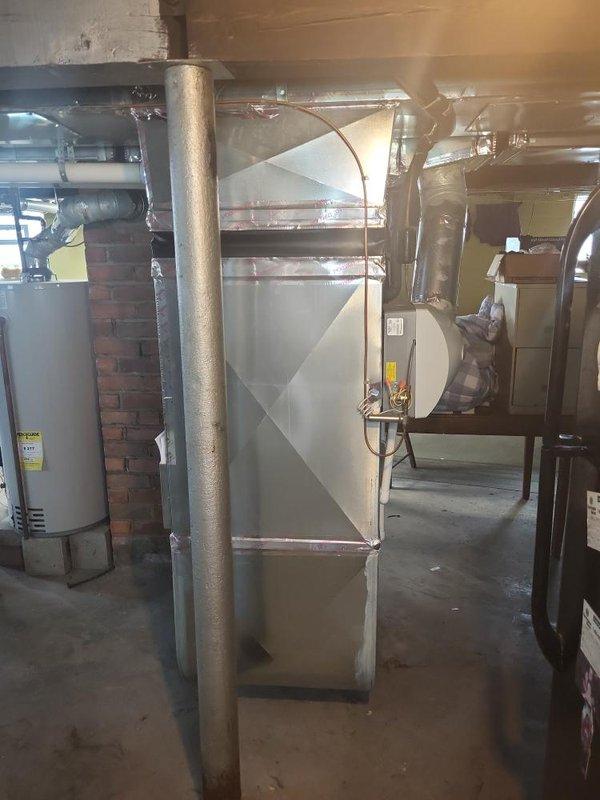 Provided comprehensive estimate for complete HVAC system replacement in basement location. Existing 10+ year old air conditioning unit had failed inspection and required replacement. Evaluated current Bryant furnace system with natural gas fuel source, assessed existing ductwork configuration including sheet metal plenum with cross-bracing, and documented mechanical room layout with water heater and chimney infrastructure to ensure proper clearances and code compliance for new equipment installation.