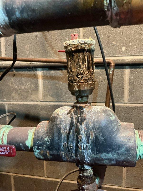 Responded to no heat call for 12-year-old Utica MGB 170J hot water boiler. Upon inspection, found circulator pump had failed due to severe corrosion and mineral buildup on pump housing and associated fittings. Replaced defective circulator pump with new unit, including new isolation valves and copper connections. Tested system operation, confirmed proper water flow and heat distribution throughout zones. System restored to full operational status.