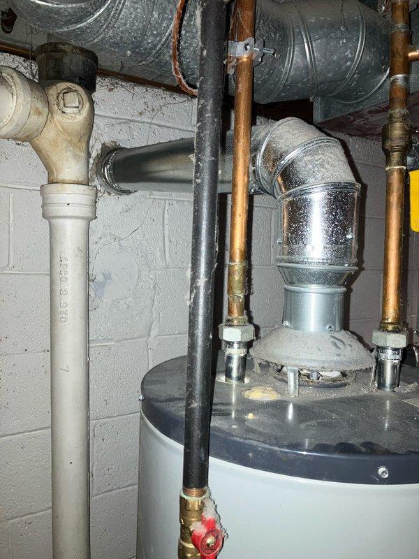 Provided estimate for replacement of 70-gallon hot water tank located in basement. Current unit is 11+ years old and still operational but nearing end of service life. Assessed existing plumbing configuration including copper supply lines, PVC venting, gas connections, and associated mechanical infrastructure to determine replacement specifications and installation requirements.