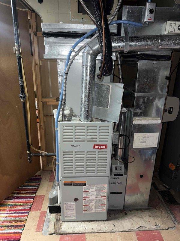 Responded to service call for central air conditioning system running but producing little to no airflow through vents with no cooling capacity. Upon inspection, discovered severely clogged evaporator drain pan with excessive accumulation of dirt, biological growth, and sediment blocking proper drainage and restricting airflow. Cleaned and cleared drain pan assembly, removed debris buildup from drain opening, and restored proper condensate drainage function. Verified system operation with adequate airflow restored through all vents and cooling capacity returned to normal parameters.