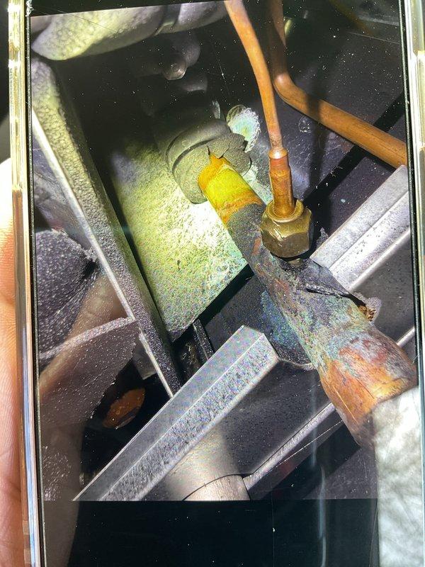 Responded to no cooling complaint on 2-year-old air conditioning system. Upon inspection, found dual capacitor failure preventing compressor operation while indoor blower continued to run normally. Replaced failed capacitors, verified proper electrical connections, and tested system operation. Unit restored to full cooling capacity with all components functioning within normal parameters.