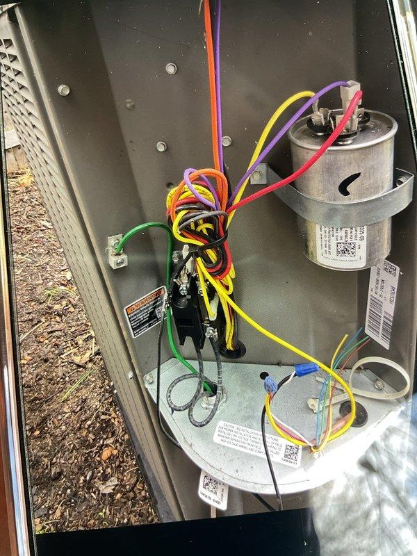 Responded to no cooling complaint on 2-year-old air conditioning system. Upon inspection, found dual capacitor failure preventing compressor operation while indoor blower continued to run normally. Replaced failed capacitors, verified proper electrical connections, and tested system operation. Unit restored to full cooling capacity with all components functioning within normal parameters.