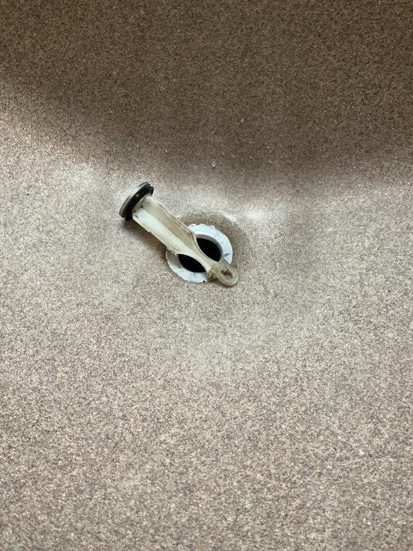 Responded to recurring issue where toilet flushing caused bathtub to gurgle in first-floor bathroom of 70-year-old home. Inspected plumbing system and identified venting problem consistent with previous service call. Replaced corroded shut-off valve and associated hardware showing significant oxidation and wear, installed new braided stainless steel supply line, and verified proper drainage and venting to eliminate gurgling condition.