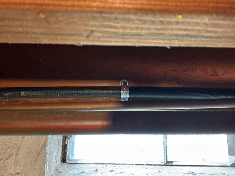 Completed gas line installation and routing work in accordance with approved estimate. Installed new gas piping from water heater location through basement mechanical room, running lines along floor joists to designated endpoint. Routed copper and black iron pipe through underside of deck structure, securing all lines with appropriate fasteners and supports to wooden beams. Installed shutoff valve on vertical gas line connected to water heater for safety and code compliance. All gas line work performed to local building codes and manufacturer specifications, with proper pipe sizing and fitting connections. System tested and verified operational upon completion.