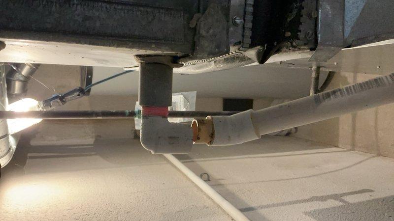 Completed comprehensive tune-up on approximately 20-year-old air conditioning system with basement coil location. Performed full system inspection including air handler and ductwork components, verified humidifier operation and water supply connections, and documented equipment condition with photographic records. Unit was operational at time of service with all components functioning within normal parameters.