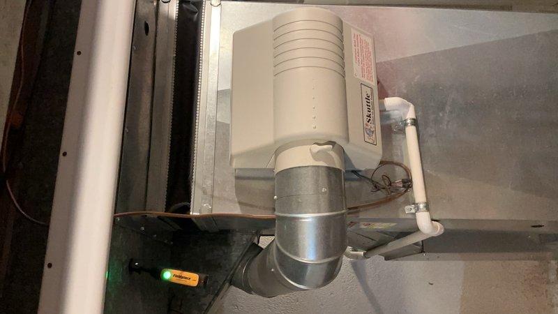 Completed comprehensive tune-up on approximately 20-year-old air conditioning system with basement coil location. Performed full system inspection including air handler and ductwork components, verified humidifier operation and water supply connections, and documented equipment condition with photographic records. Unit was operational at time of service with all components functioning within normal parameters.