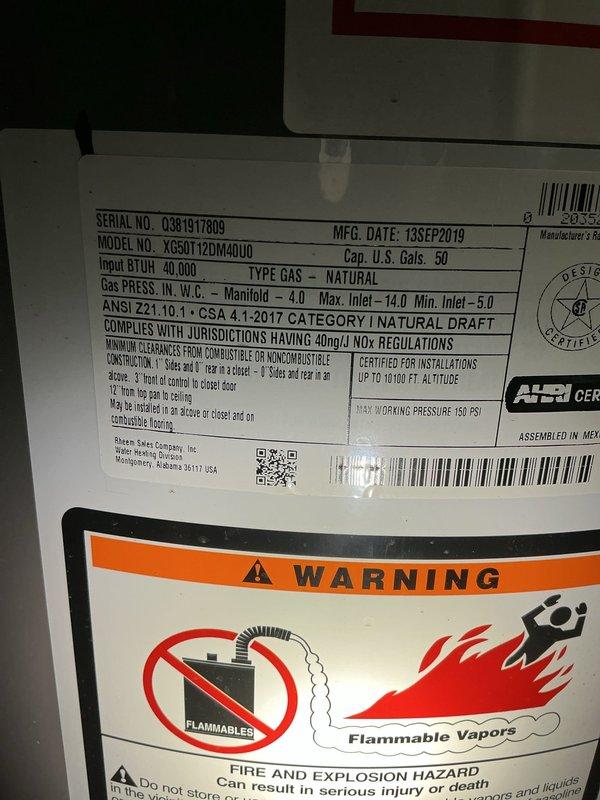 Responded to complaint of rotten egg smell from hot water throughout residence, ongoing for 2-3 weeks. Inspected 50-gallon natural gas Performance Platinum water heater (Model M50T12DM40U0, manufactured September 2019, 40,000 BTU input) located in basement. Identified hydrogen sulfide odor characteristic of sulfate-reducing bacteria growth within tank, common in units with magnesium anode rods and homes with well water or low chlorine levels. Recommended and performed anode rod replacement with aluminum/zinc alloy rod to eliminate bacterial growth and prevent future odor issues. Flushed tank to remove sediment and bacterial buildup. Verified proper venting, gas pressure, and operational safety of unit. Tested hot water at multiple fixtures throughout home to confirm odor elimination. Unit operating within manufacturer specifications with no safety concerns noted.