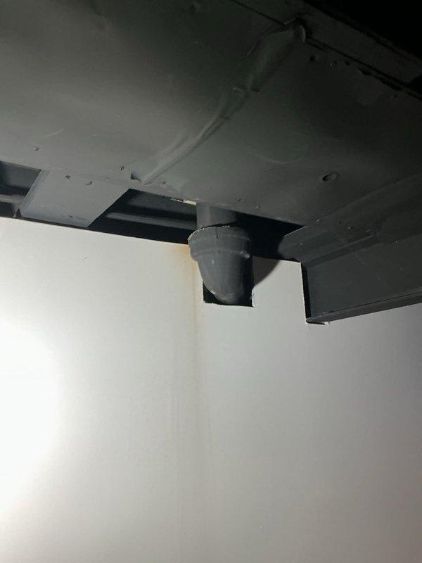 Responded to water leak complaint at customer-supplied toilet installation approximately six years old. Upon inspection, confirmed active water leak originating from toilet fixture resulting in visible mold growth in surrounding bathroom area. Documented conditions through photography showing toilet installation, bathroom fixtures, and affected ceiling cavity with exposed structural elements and moisture damage. Leak source traced to toilet assembly with water infiltration causing deterioration of adjacent building materials. Assessed extent of water damage including ceiling discoloration and compromised substrate requiring remediation. Verified leak was related to original toilet installation and documented findings for warranty determination and further action recommendations.
