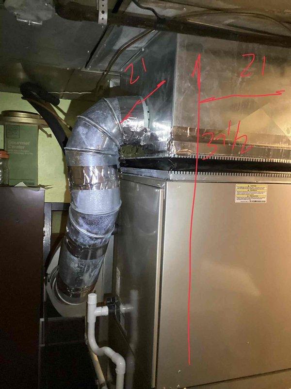 Completed comprehensive Gold AC inspection on a single-unit residential HVAC system with equipment exceeding 10 years of age. Evaluated operational air handler/coil unit located in basement mechanical room, documented existing furnace installation with visible duct repairs and sealing work, and assessed electrical panel connections and service capacity. Equipment was confirmed operational at time of inspection, and photographic documentation was captured for replacement estimate preparation.