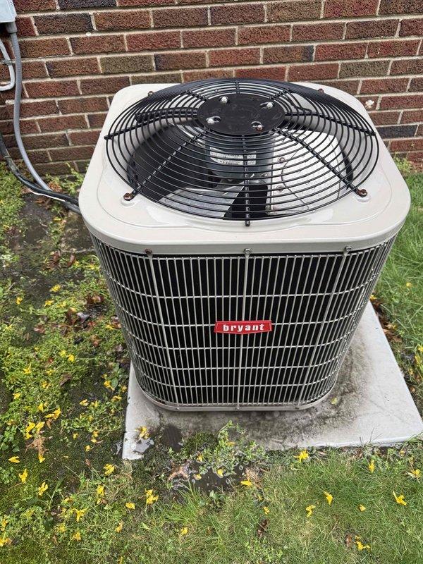 Completed Gold AC Inspection on a 16-year-old Bryant air conditioning system with air handler located in basement. Performed comprehensive maintenance inspection of outdoor condenser unit, which was found in good operating condition with no visible damage, rust, or deterioration to the cabinet or components. Verified proper condenser placement on concrete pad, confirmed adequate clearance around unit, and documented that surrounding area was clear of debris for optimal airflow and system performance.