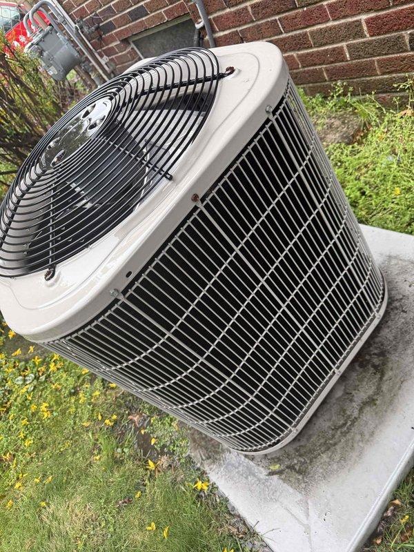 Completed Gold AC Inspection on a 16-year-old Bryant air conditioning system with air handler located in basement. Performed comprehensive maintenance inspection of outdoor condenser unit, which was found in good operating condition with no visible damage, rust, or deterioration to the cabinet or components. Verified proper condenser placement on concrete pad, confirmed adequate clearance around unit, and documented that surrounding area was clear of debris for optimal airflow and system performance.
