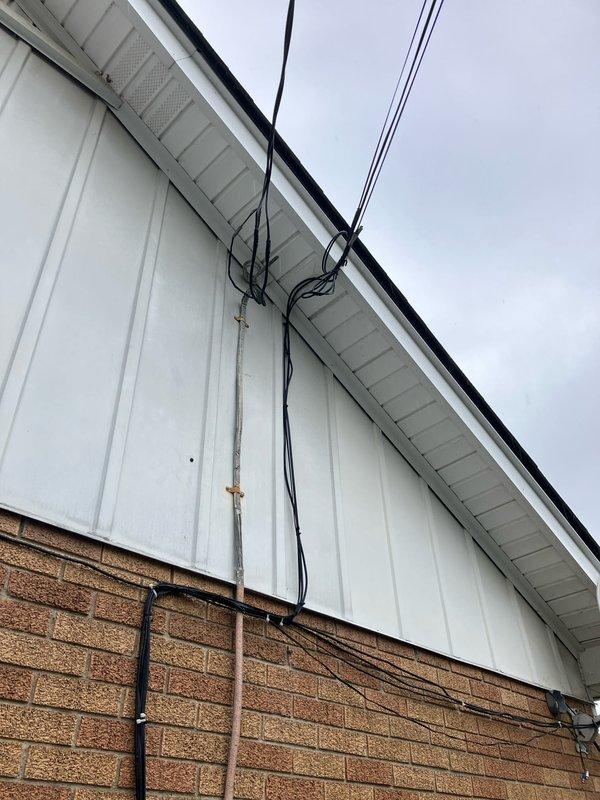 Conducted comprehensive estimate for complete HVAC system replacement on 1995 installation. Furnace evaluation revealed elevated carbon monoxide levels at 300ppm in exhaust, though no visible cracks or corrosion were detected in heat exchanger. Air conditioning unit diagnosed with low refrigerant charge of R-22, indicating potential leak in aging system given refrigerant phase-out. Documentation and photographic evidence captured of existing exterior equipment installation and utility connections for replacement planning purposes.