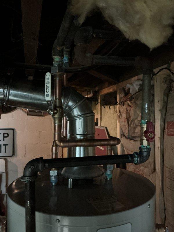 Installed 40-gallon tanked water heater in residential basement utility area. Connected all water supply lines, gas piping, and exhaust venting per code requirements. Verified proper operation of burner assembly, safety controls, and temperature settings upon completion.