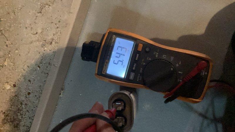 Completed comprehensive tune-up and inspection on basement-located furnace and air conditioning system of unknown age. Performed detailed visual inspection of equipment components, noting visible corrosion and age-related wear on mounting brackets and hardware. Conducted electrical diagnostics using digital multimeter to verify proper voltage readings and component functionality, with measurements indicating system operating within acceptable parameters.