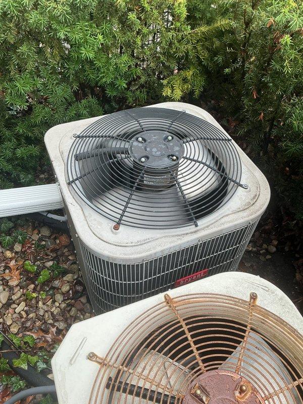Completed routine AC tune-up maintenance on two 7-year-old outdoor condenser units as part of Gold Club membership. Performed comprehensive system inspection including electrical connections, refrigerant levels, amperage draws, and component operation. Both units operating within manufacturer specifications. Noted significant rust and corrosion on fan guards of both condensers due to prolonged weather exposure, though not affecting current system performance. Verified proper airflow through condenser coils, checked capacitor values, and ensured all safety controls functioning correctly. Replaced air filter and cleared debris from gravel pad surrounding units. Systems cooling efficiently with no immediate service needs identified. Recommended monitoring fan guard condition for potential future replacement to prevent deterioration of underlying components.