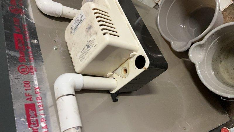 Responded to service call for 18-year-old furnace system located in basement with reported issue of broken water line feeding the humidifier. Upon inspection, identified failed water supply line connection to whole-house humidifier unit. Removed and replaced damaged water supply tubing and fittings to restore proper water flow to humidifier system. Inspected humidifier evaporator pad and found significant mineral buildup and discoloration indicating reduced efficiency. Replaced heavily soiled evaporator pad with new filter media to ensure optimal humidification performance. Checked condensate pump assembly and associated drainage components for proper operation. Verified all connections secure and tested system operation. Humidifier now receiving adequate water supply and operating within normal parameters.