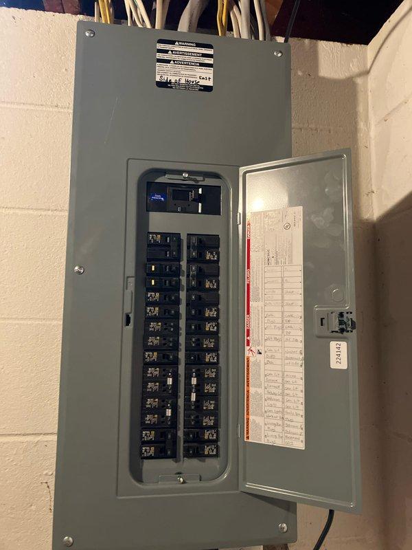Responded to service call for non-operational central air conditioning system with no heating or cooling capability. Performed comprehensive diagnostic evaluation of outdoor condensing unit located in exterior alcove and inspected electrical distribution panel to assess power supply and circuit breaker configuration. Documented equipment condition, installation environment, and electrical infrastructure through photographic evidence to support replacement estimate recommendations.