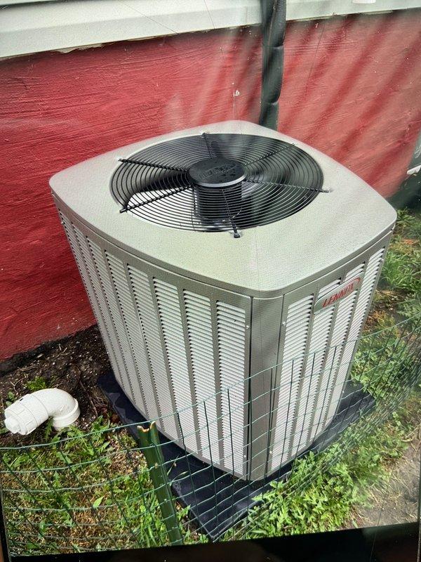 Completed comprehensive Gold AC inspection on a 1-year-old residential air conditioning system with air handler located in basement and condenser unit positioned on exterior pad. Performed thorough visual inspection of outdoor condenser unit, verifying proper placement on mounting pad, checking fan guard integrity, and confirming adequate clearance around unit. Inspected indoor air handler components including air filter condition and pleated filter media. Evaluated system accessibility and overall equipment condition. All components inspected showed proper installation and maintenance status consistent with newer equipment age. System confirmed operational at time of inspection.