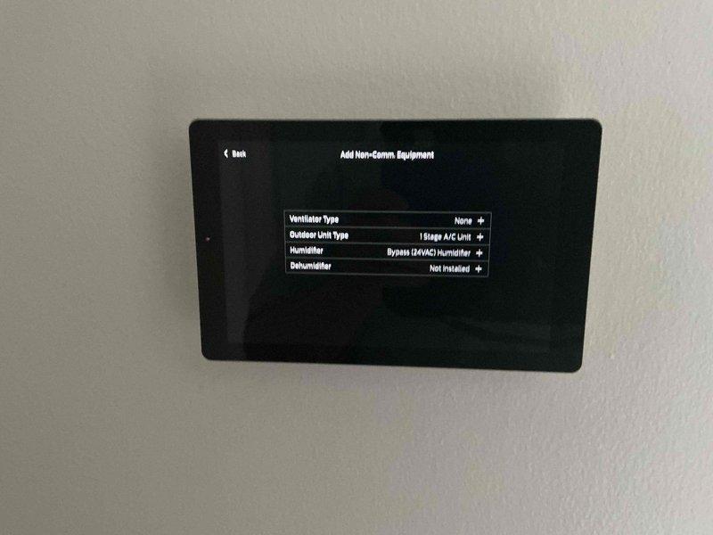 Responded to service call regarding thermostat operation issue where air conditioning system could not be activated. Upon arrival, evaluated 4-month-old touchscreen thermostat control panel and verified proper configuration settings for single-stage AC unit with bypass humidifier. Provided customer education on thermostat interface navigation and proper operation procedures to enable cooling mode. Inspected outdoor condensing unit to confirm equipment was operational and ready for system activation. Customer instructed on correct menu selections and system controls for future AC operation.