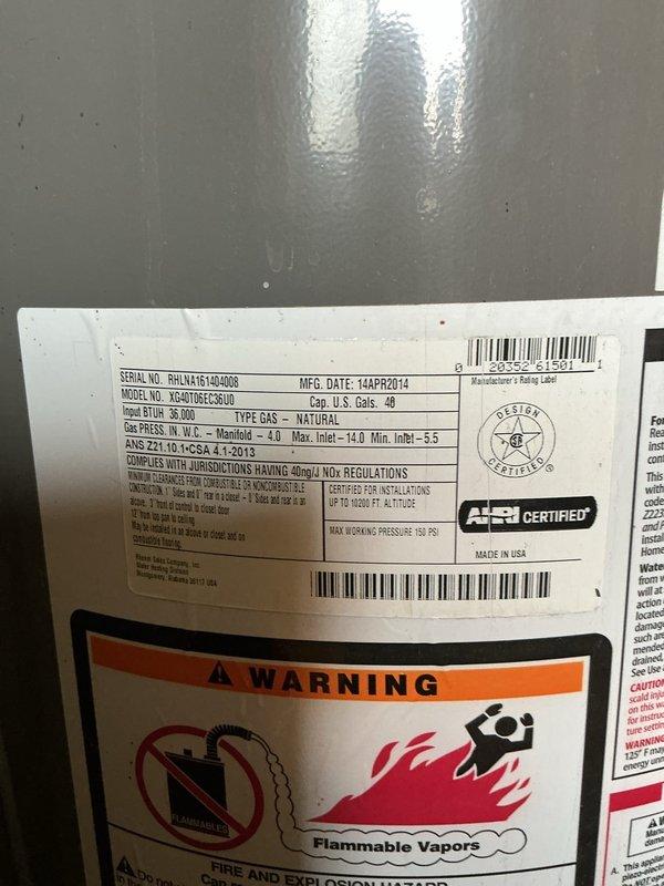 Responded to service call for 12-year-old Rheem Performance 40-gallon natural gas water heater located in utility room with reported venting issues. Upon inspection, diagnosed improper venting preventing safe exhaust of combustion gases. Completed installation of new tanked water heater system, including proper venting configuration to ensure adequate draft and combustion air flow. Connected supply lines with flexible braided hoses, installed temperature and pressure relief valve, and verified all gas connections for leak-free operation. System tested and operational upon completion.