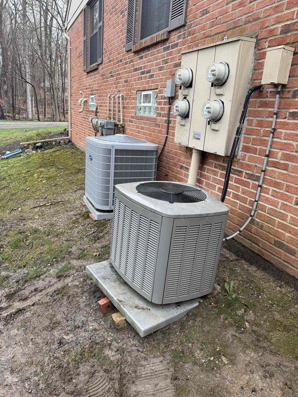 Completed comprehensive Gold AC inspection and tune-up on residential R-410A air conditioning system as part of plan membership maintenance. Performed full system evaluation including inspection of dual outdoor condensing units, verified proper leveling and placement on concrete pads, checked electrical connections and components per manufacturer wiring diagram specifications, measured refrigerant operating pressures against factory charging chart, inspected condenser coils and fan operation, and documented equipment condition with photographic records. All systems found operating within normal parameters with no immediate repairs required.