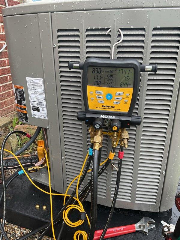 Performed AC system start-up on outdoor condensing unit and basement evaporator coil. Connected diagnostic manifold gauges to verify refrigerant pressures and system operation, confirmed proper electrical connections and refrigerant line installation. All equipment tested and operational within manufacturer specifications.