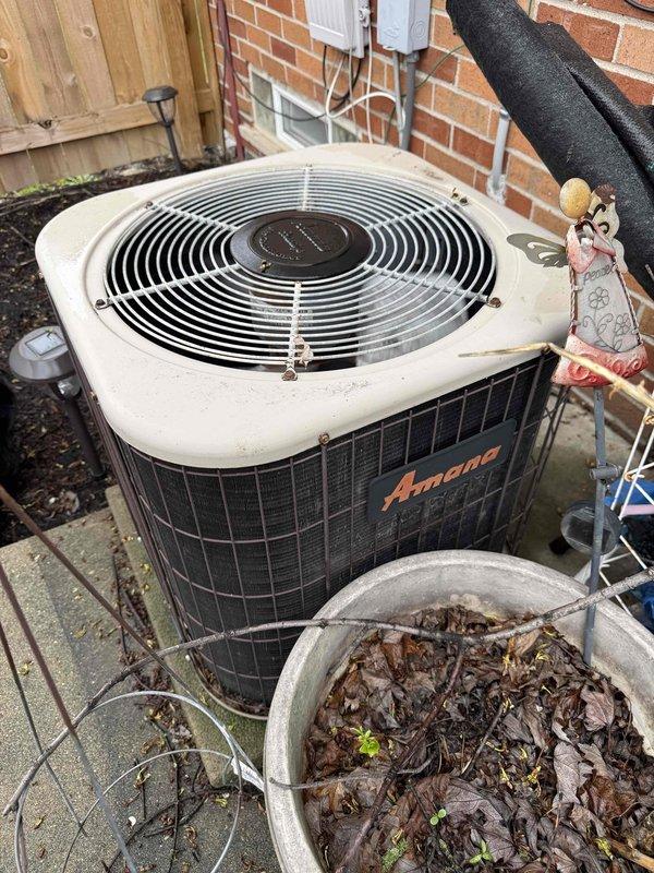 Responded to no cooling complaint on 34-year-old Amana air conditioning system. Upon arrival, confirmed unit was running but blowing warm air only, with outdoor fan motor operating. Performed diagnostic testing using digital multimeter to check electrical components and system operation. Given the advanced age of the equipment at 34 years—well beyond the typical 15-20 year lifespan of residential AC units—and the complete loss of cooling capacity, recommended system replacement rather than repair due to obsolete parts availability, decreased efficiency, and likelihood of additional imminent failures.