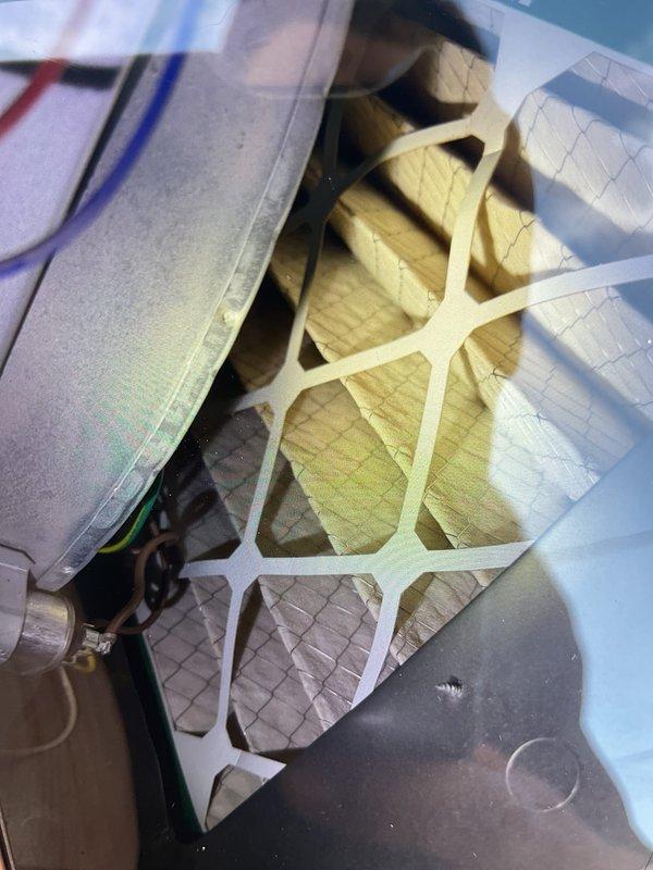 Completed comprehensive Gold AC inspection on multi-unit residential HVAC system with 11-year-old equipment. Inspected outdoor condenser unit positioned on exterior wall with proper clearance from debris, verified fan operation and examined electrical connections. Serviced basement-located air handler, inspected and evaluated pleated air filter condition within the unit, and assessed blower motor assembly and associated mechanical components. All systems operating within normal parameters at time of inspection.