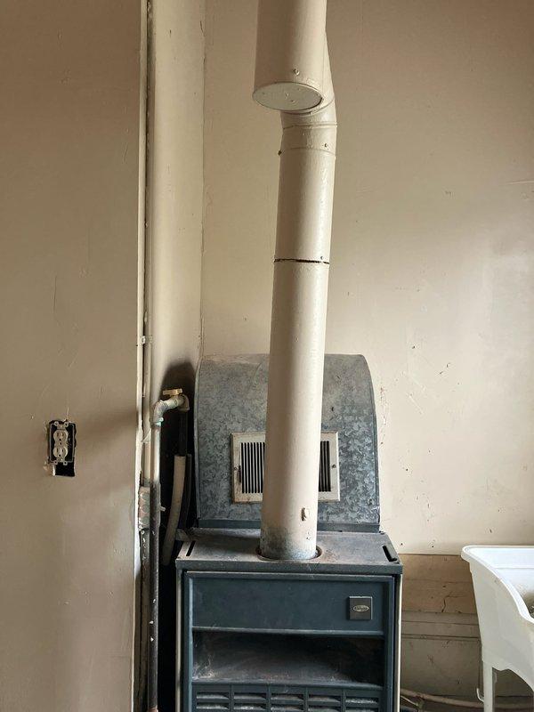 Conducted comprehensive inspection of basement-located furnace and identified critical safety hazard with cracked left and right cells of heat exchanger. Evaluated existing 70% efficiency furnace determined to be oversized for application and of unknown age. Provided detailed replacement estimate for properly sized high-efficiency furnace system to address heat exchanger failure and improve operational efficiency.