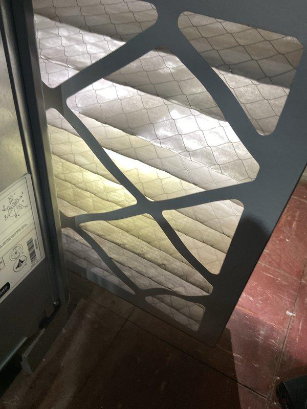 Completed comprehensive Gold AC Inspection and tune-up service on two outdoor condensing units. Performed standard maintenance procedures including inspection of refrigerant system components, verification of proper system pressures, examination of electrical connections, and assessment of overall unit operation. Inspected and documented air filtration system condition, noting pleated media filter with visible dust accumulation in return air compartment. Reviewed manufacturer safety labels and system specifications on outdoor equipment, confirming proper warning placards present regarding refrigerant handling and fire hazards. Both AC systems operational at time of service completion with no immediate repairs required.