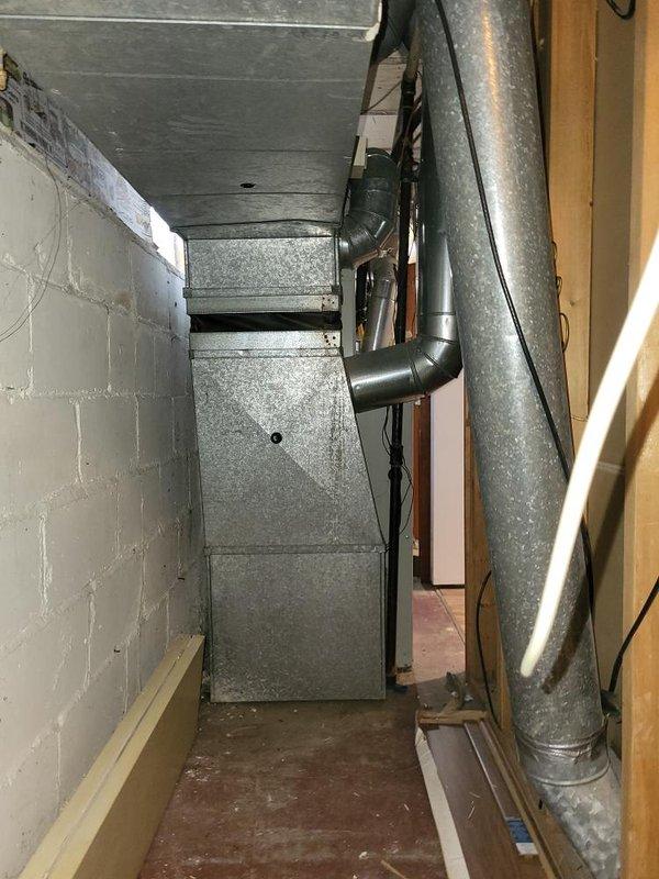 Conducted comprehensive on-site evaluation of existing HVAC system in basement mechanical room to provide full system replacement estimate. Assessed current furnace unit, ductwork configuration, and available installation space within confined basement area featuring concrete block walls and exposed framing. Documented existing equipment specifications, duct connections, electrical infrastructure, and spatial constraints through photographic documentation to prepare detailed quotes for complete HVAC and furnace replacement as well as air conditioning only replacement options.