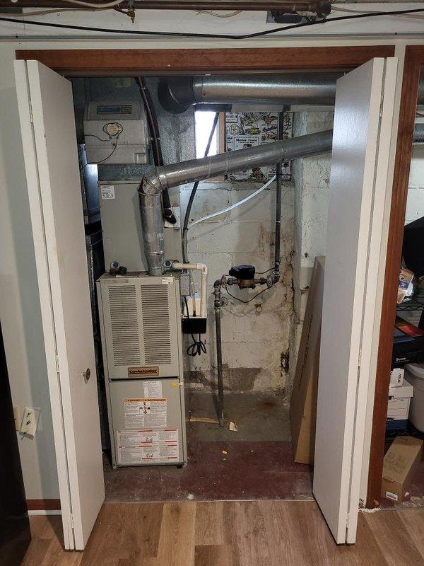 Conducted comprehensive on-site evaluation of existing HVAC system in basement mechanical room to provide full system replacement estimate. Assessed current furnace unit, ductwork configuration, and available installation space within confined basement area featuring concrete block walls and exposed framing. Documented existing equipment specifications, duct connections, electrical infrastructure, and spatial constraints through photographic documentation to prepare detailed quotes for complete HVAC and furnace replacement as well as air conditioning only replacement options.