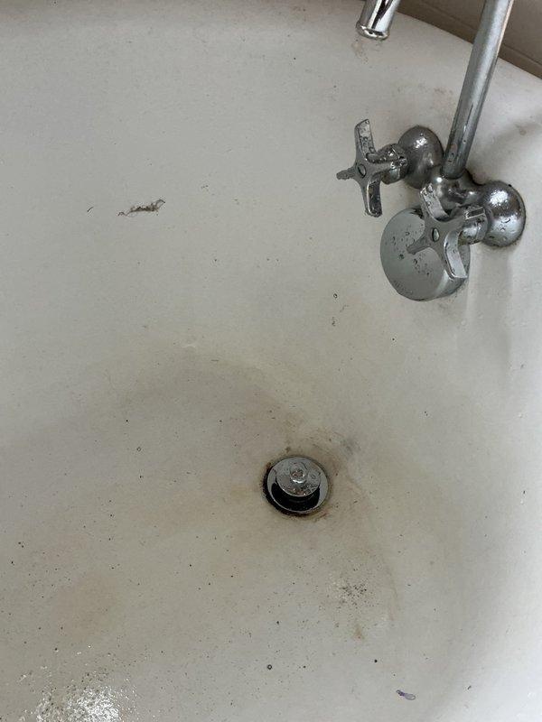 Completed waste and overflow assembly replacement on bathtub fixture. Removed old corroded drain assembly and stopper mechanism, installed new chrome waste and overflow kit with proper sealing to prevent leakage. Tested drainage system for proper flow and verified all connections are watertight and functioning correctly.