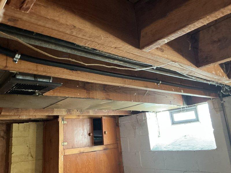 Removed existing soft copper gas line and properly capped the connection point. Installed approximately 10-15 feet of new 1/2" black iron gas pipe to code specifications, incorporating an AGA-approved gas shutoff valve and appliance flex connector for safe appliance connection. All gas piping was securely anchored to structural joists using appropriate hangers and brackets to prevent movement and ensure long-term stability. Additionally, installed 4" rigid metal vent pipe with proper routing and termination, including a new 4" exterior vent hood to provide adequate exhaust ventilation for the dryer appliance.