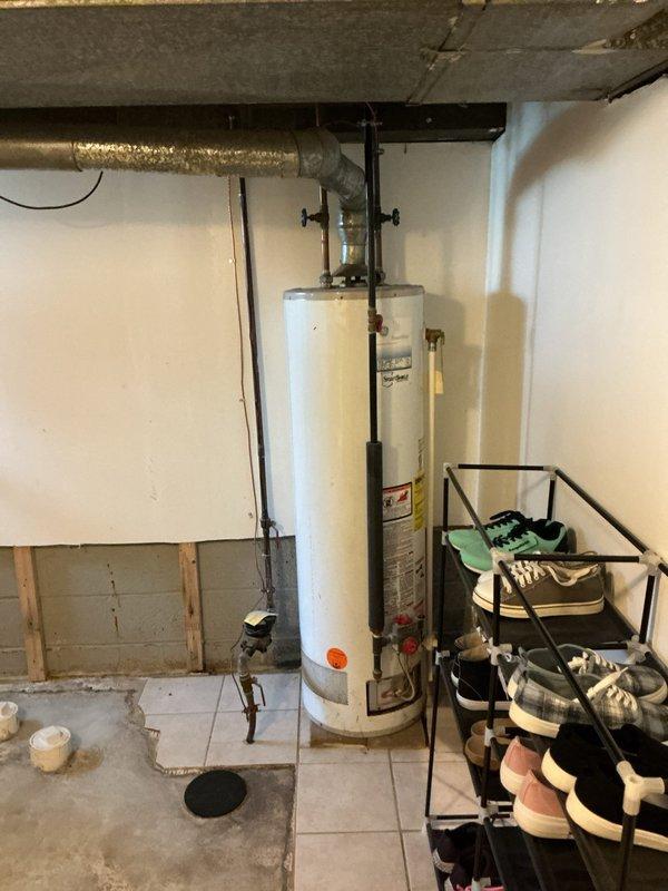 Responded to low water pressure complaint at kitchen faucet where homeowner had attempted gasket replacement and discovered black sediment debris. Upon inspection, identified deteriorated internal faucet components and sediment accumulation causing flow restriction. Disassembled faucet assembly, flushed supply lines to remove remaining particulate matter, and replaced worn gasket and cartridge components. Restored proper water pressure and verified no leaks at connections.