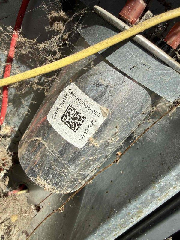 Responded to service call for air conditioning system not operating properly after reset and filter replacement. Performed diagnostic evaluation on 10+ year old unit with evaporator coil located in furnace. Upon inspection, found equipment showing significant age-related wear, dust accumulation, and debris throughout system components. Evaluated blower motor assembly, electrical connections, and refrigerant lines. Identified potential issues with motor operation and electrical wiring connections requiring attention. Documented equipment condition including manufacturer information and component status through photographic evidence for record-keeping purposes.