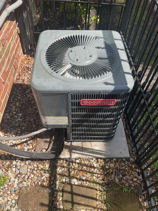 Completed AC inspection on Goodman outdoor condenser unit less than 10 years old. Unit was operational and located on concrete pad with proper clearance. Performed visual inspection of exterior components, grille, and fan assembly, confirming all components were clean and well-maintained with no visible damage or debris buildup.