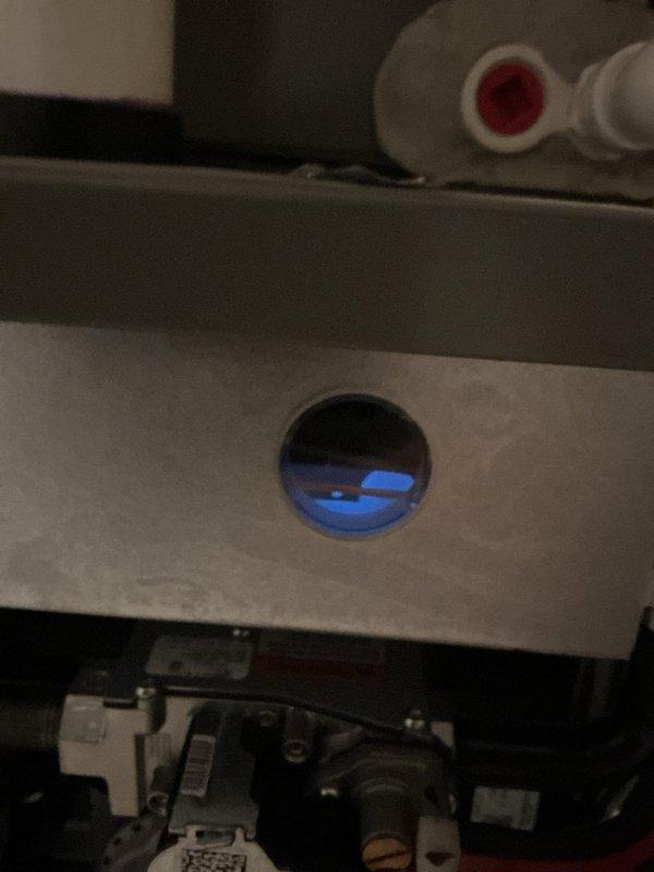 Responded to service call for recently installed furnace that failed to restart following city inspection testing. Upon arrival, performed diagnostic evaluation of basement-located unit and confirmed furnace ignition system and burner assembly were functioning properly with blue flame visible through observation port. Determined that unit had entered normal purge cycle following inspection testing, which temporarily prevented immediate restart as designed safety feature. Verified blower motor operation, checked all electrical connections and control board functionality, and confirmed proper gas valve operation. Educated homeowner on standard purge cycle timing and safety protocols that prevent immediate furnace restart after shutdown. System returned to normal operation without requiring component replacement or repair.