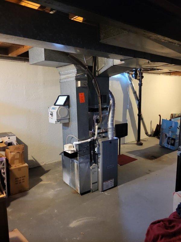 Responded to service call for 34-year-old air conditioning system not cooling and blowing warm air. Upon inspection, found outdoor condenser unit nearly depleted of R22 refrigerant. Due to the system's age, obsolete refrigerant type, and condition of equipment, provided comprehensive estimate for complete HVAC system replacement including new outdoor condenser unit, indoor air handler, refrigerant lines, electrical disconnect, and thermostat controls.