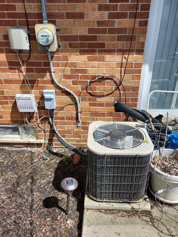 Responded to service call for 34-year-old air conditioning system not cooling and blowing warm air. Upon inspection, found outdoor condenser unit nearly depleted of R22 refrigerant. Due to the system's age, obsolete refrigerant type, and condition of equipment, provided comprehensive estimate for complete HVAC system replacement including new outdoor condenser unit, indoor air handler, refrigerant lines, electrical disconnect, and thermostat controls.
