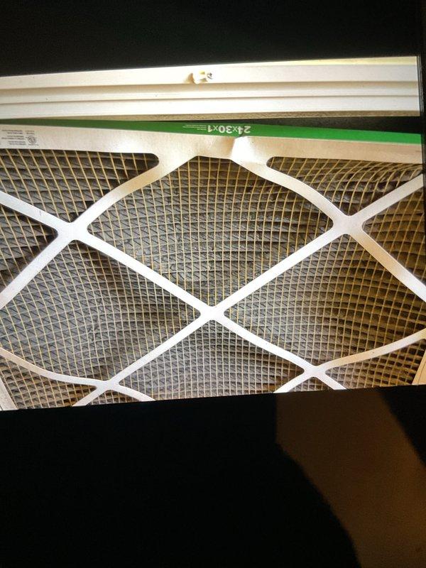 Completed comprehensive Gold AC Inspection on a 6-year-old residential air conditioning system with air handler located in basement. Performed full system evaluation including inspection of outdoor condenser unit, verified proper electrical connections and conduit integrity, assessed air filter condition (20x30x1), confirmed adequate clearance around condenser unit, and documented equipment operation. System found operating within normal parameters with no immediate service needs identified.