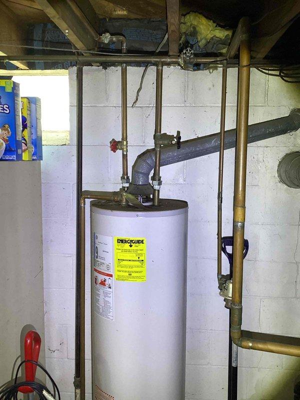 Responded to service call for non-functioning hot water boiler in basement. Upon inspection, determined 21-year-old Dunkirk boiler was unsafe to operate due to improper ignition and extensive corrosion throughout the system, particularly on vertical piping and connections. Unit displayed three indicator lights but failed to light properly. Documented existing conditions showing significant rust deterioration on piping components and aging infrastructure. Provided comprehensive estimate for boiler replacement due to safety concerns and equipment age exceeding serviceable lifespan.