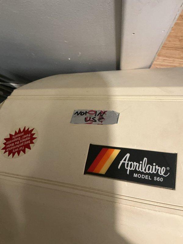 Responded to service call for non-operational humidifier in first-floor furnace room. Upon arrival, inspected 15-year-old Aprilaire Model 560 whole-house humidifier attached to furnace system. Unit was found to be marked "NOT IN USE" and confirmed non-functional. Documented existing conditions with photos showing humidifier installation and internal HVAC components. Verified furnace heating and cooling systems remain fully operational and independent of humidifier issue. Advised customer on humidifier status and discussed options for repair or replacement given age of unit.