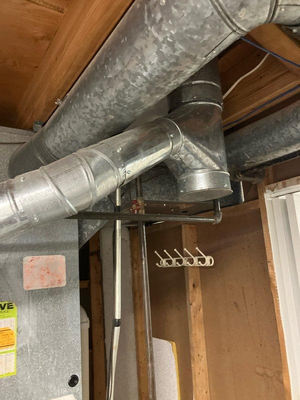 Provided estimate for complete air conditioning system replacement at residential property with non-functional outdoor condenser unit showing significant weathering and deterioration. Assessed existing basement-located HVAC infrastructure including natural gas furnace and galvanized ductwork system to determine compatibility requirements for new AC equipment installation. Documented current equipment condition and site-specific factors to develop comprehensive replacement proposal for restoring cooling capacity to the home.