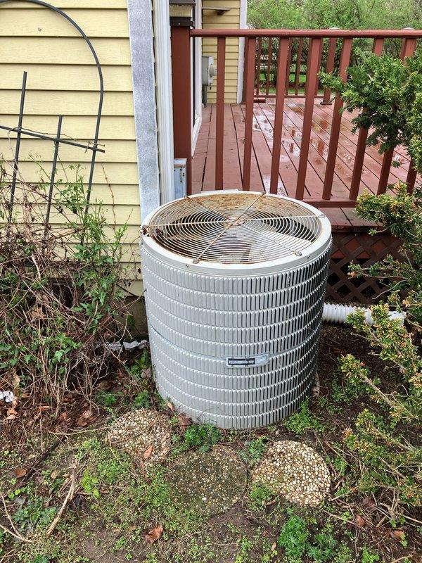 Provided estimate for complete air conditioning system replacement at residential property with non-functional outdoor condenser unit showing significant weathering and deterioration. Assessed existing basement-located HVAC infrastructure including natural gas furnace and galvanized ductwork system to determine compatibility requirements for new AC equipment installation. Documented current equipment condition and site-specific factors to develop comprehensive replacement proposal for restoring cooling capacity to the home.